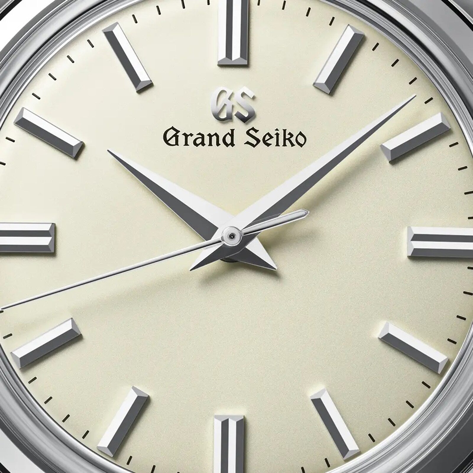Close-up of a Grand Seiko Manual Elegance watch face featuring silver hour markers and hands on a cream dial, displaying 10:08:36 and powered by the precise 9S64 mechanical calibre movement.