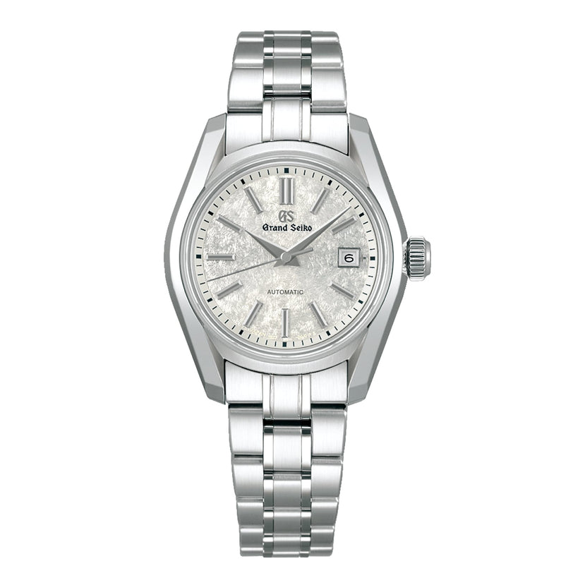 A Grand Seiko Ladies Automatic Heritage wristwatch in stainless steel, featuring a textured silver dial, Zaratsu polishing, date at 3 o’clock, and a metal link bracelet.