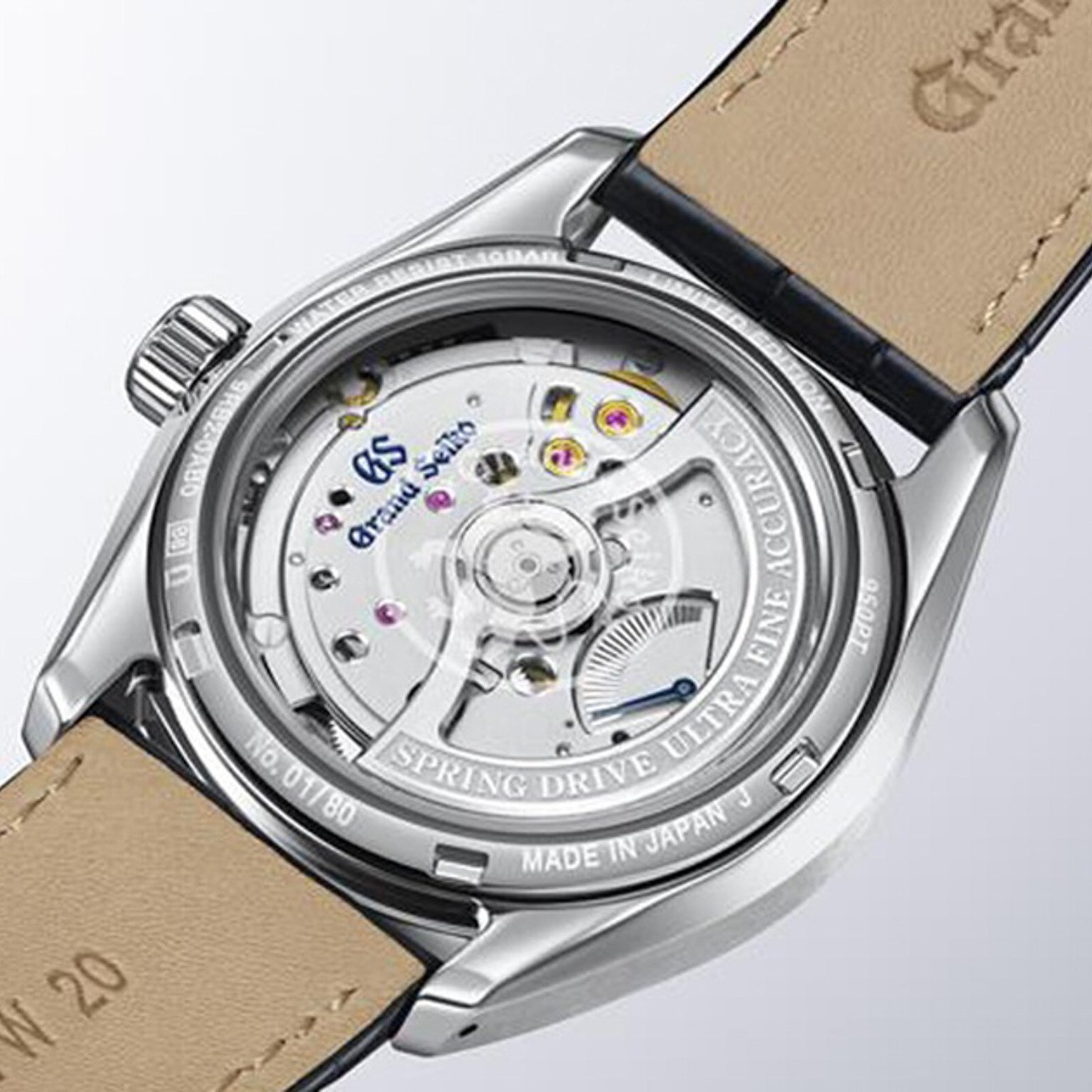 Close-up of the back of a Grand Seiko Spring Drive U.F.A Evolution 9, highlighting its mechanical movement and leather strap.