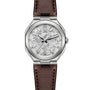 The ID Geneve Circular 1 - Mineral Grey is a silver wristwatch with a textured dial, brown leather strap, and date window at 3 o’clock.