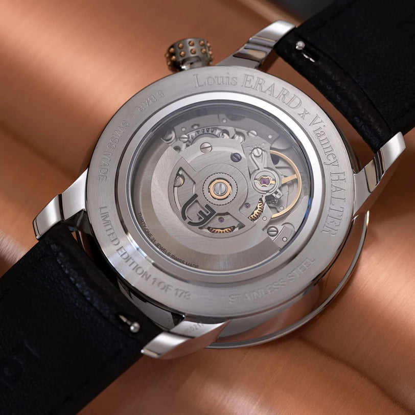 Close-up of the Le Régulateur Louis Erard x Vianney Halter II watch back by Louis Erard, displaying its exposed mechanical movement and detailed engravings.