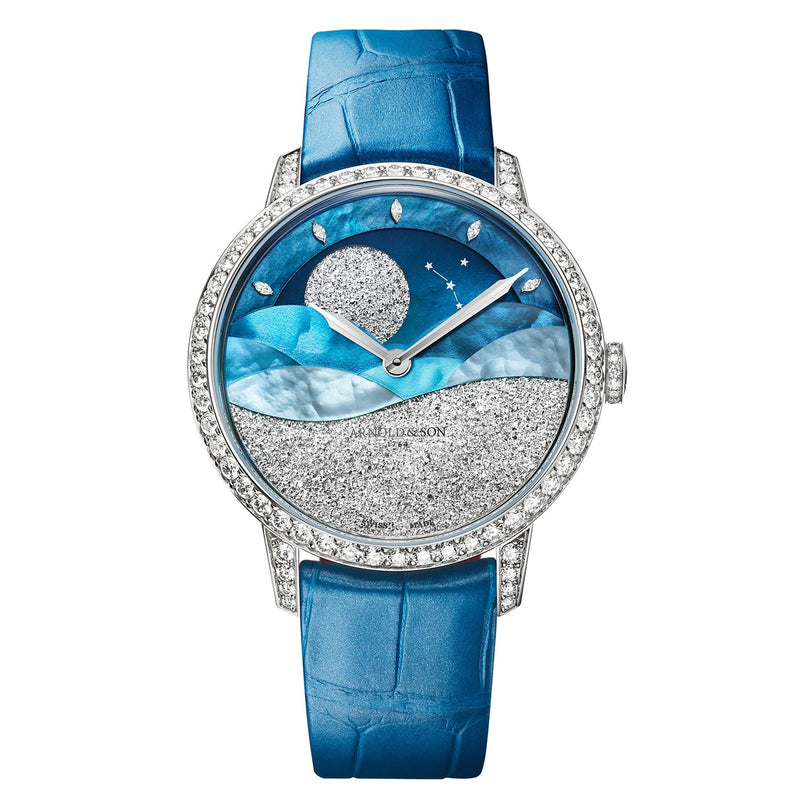 The Arnold & Son Perpetual Moon 38 White Gold Mintnight is a luxury watch with a blue strap, diamond bezel, and a celestial-themed face featuring stars and waves.