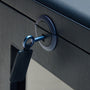 Dark blue single watch winder with textured rotating mechanism and black fabric watch holder mounted on gray leather surface.