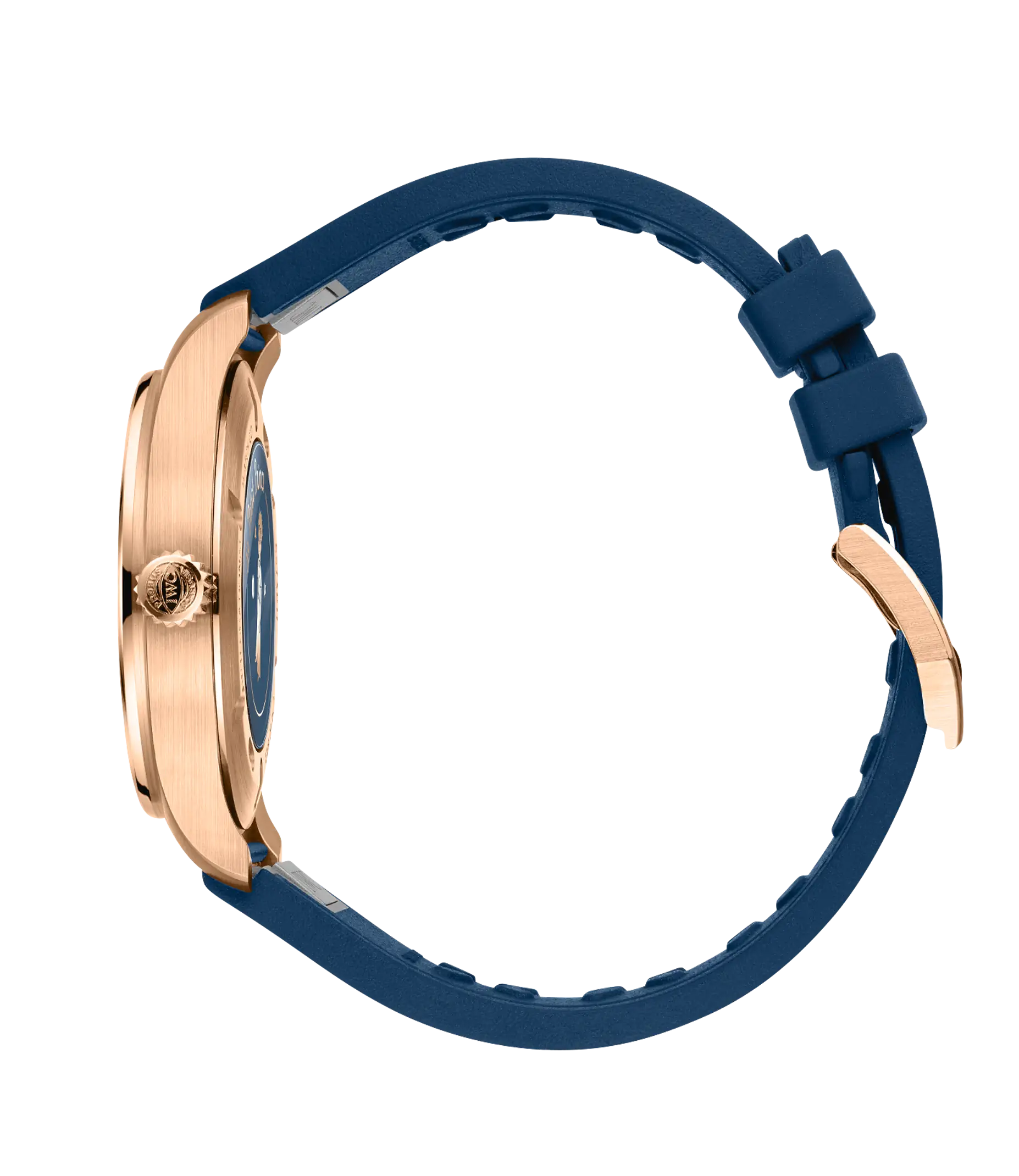Rose gold pilot's watch with blue dial and navy blue rubber strap, shown from the side.