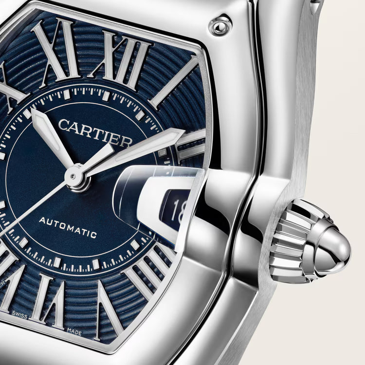 Cartier Roadster watch with blue dial, Roman numerals, silver hands, and stainless steel case with crown detail.