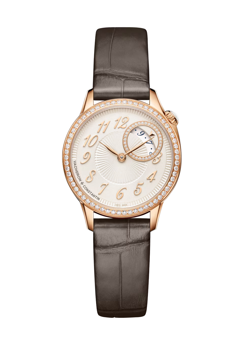 Rose gold watch with diamond-set bezel, cream dial, moon phase subdial, and dark gray leather crocodile-textured strap.