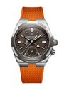 Stainless steel watch with charcoal dial, orange rubber strap, dual time zone display, and orange accent hand.