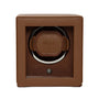 The WOLF Cub Single Watch Winder with Cover features a brown leather exterior, a clear front panel, and WOLF branding inside.
