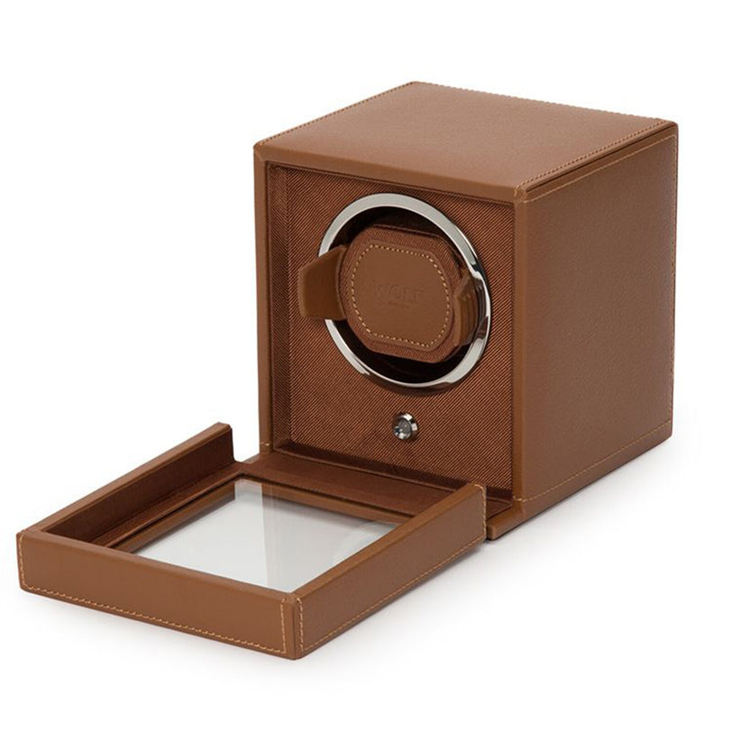 The WOLF Cub Single Watch Winder with Cover features a brown leather design and an open glass door, revealing the interior watch holder.