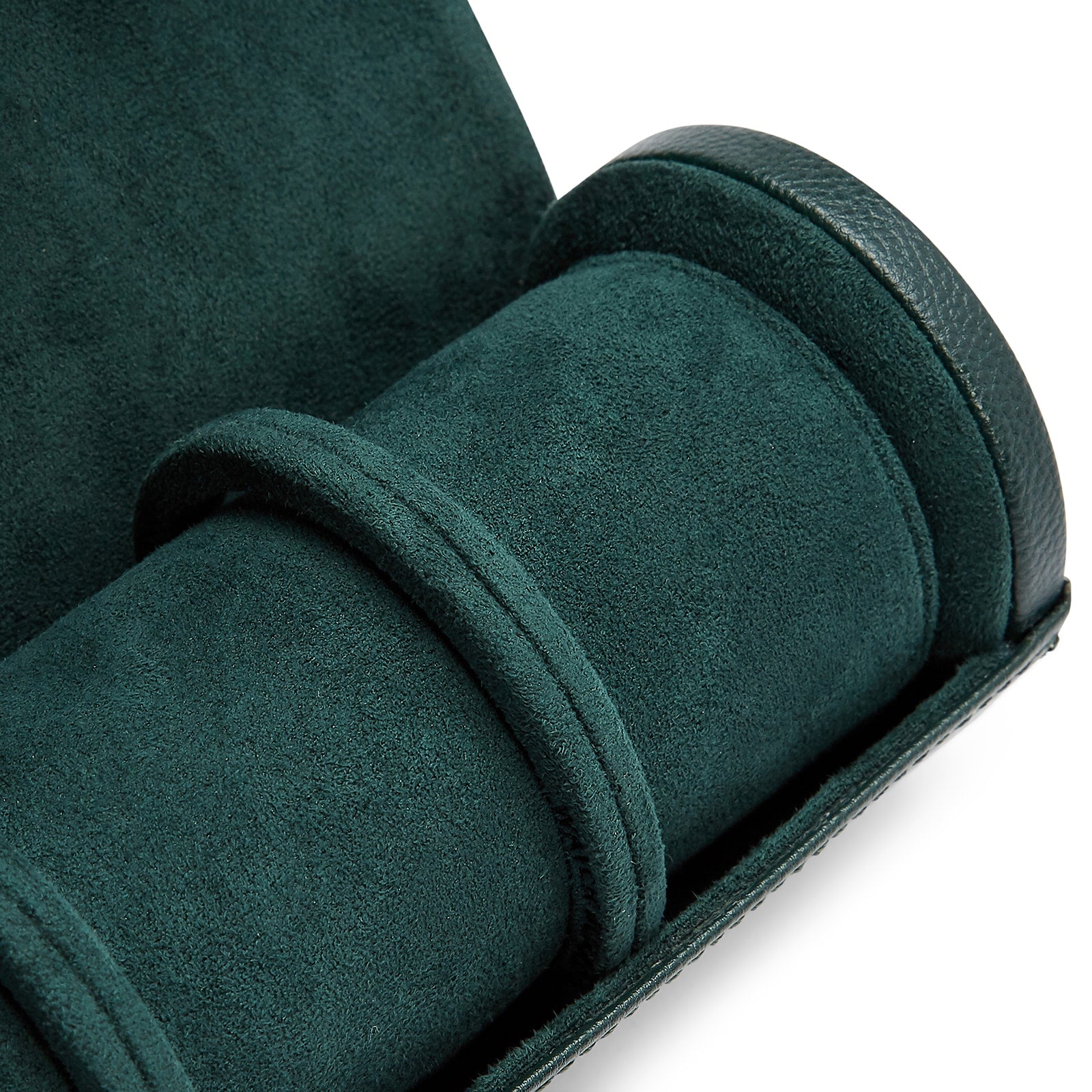 The WOLF British Racing Triple Watch Roll in dark green suede features a cylindrical compartment with two dividers and is shown partially open.