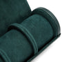 The WOLF British Racing Triple Watch Roll in dark green suede features a cylindrical compartment with two dividers and is shown partially open.
