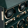 Close-up of the WOLF British Racing 6 Piece Watch Winder, featuring green and gold accents, multiple winding slots, and luxurious detailing.