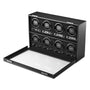 The WOLF British Racing 8 Piece Watch Winder is a black box with eight slots for single watches and a forward-opening glass lid.