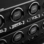 Close-up of multiple WOLF British Racing 8 Piece Watch Winders featuring control panels, black leather, and chrome detailing.