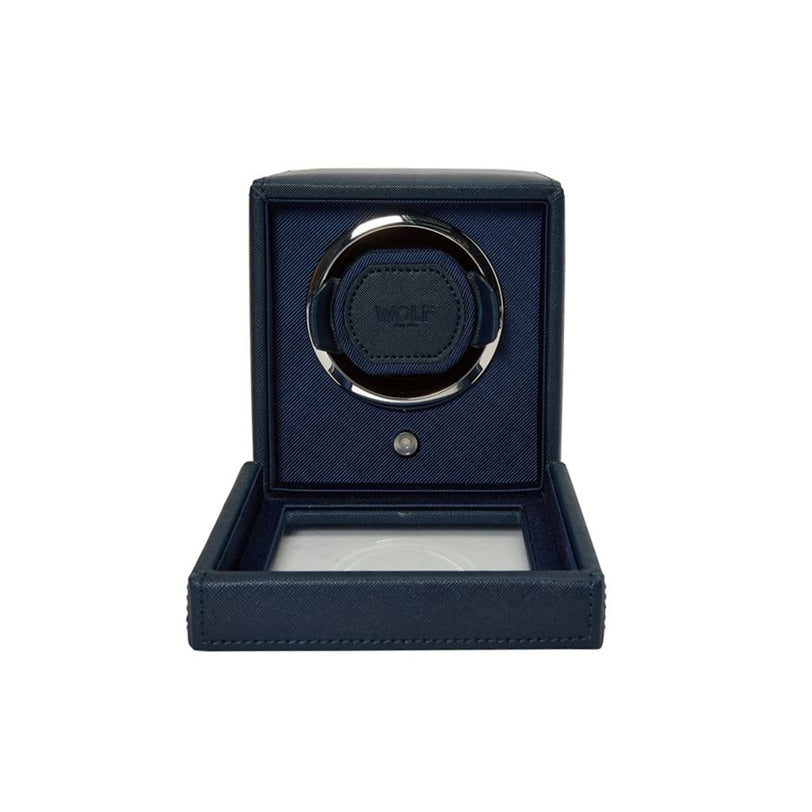 The WOLF Cub Single Watch Winder with Cover is a navy blue box featuring an open glass lid and a circular compartment inside for displaying your watch.