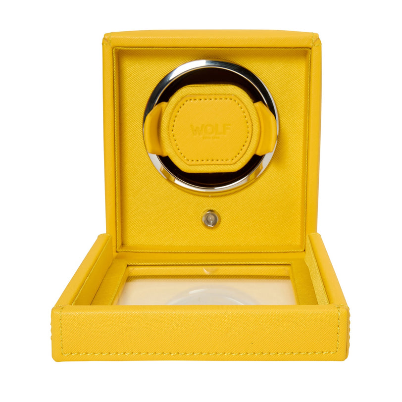 A yellow WOLF Cub Single Watch Winder with cover, featuring an open lid and a circular compartment for a watch.