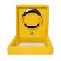 A yellow WOLF Cub Single Watch Winder with cover, featuring an open lid and a circular compartment for a watch.