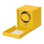 The WOLF Cub Single Watch Winder with Cover features a yellow case and transparent lid, revealing its interior compartment and winding mechanism.
