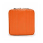 The WOLF Maria Small Zip Case is a square orange leather wallet featuring vertical stitched lines and a top zipper closure.