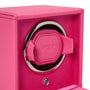 The WOLF Cub Single Watch Winder with Cover in pink features a chrome ring and a leather watch holder on the front.
