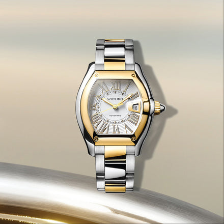 Luxury Cartier watch with two-tone design on a gradient background