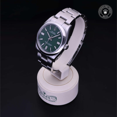 Rolex Certified Pre-owned Oyster Perpetual M126000-0005 front on black background