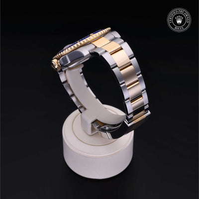 Rolex Certified Pre-owned Submariner M116613LB-0005 front on black background