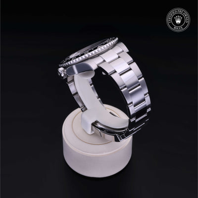 Rolex Certified Pre-owned GMT M116710LN-0001 front on black background