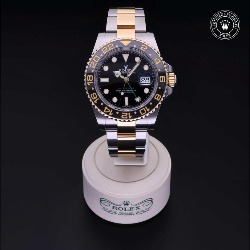 Rolex Certified Pre-owned GMT M116713LN-0001 front on black background