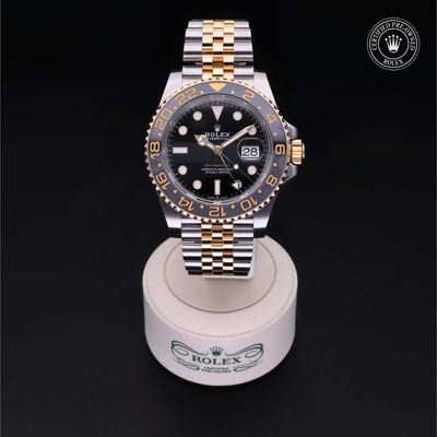 Rolex Certified Pre-owned GMT II M126713GRNR-0001 front on black background