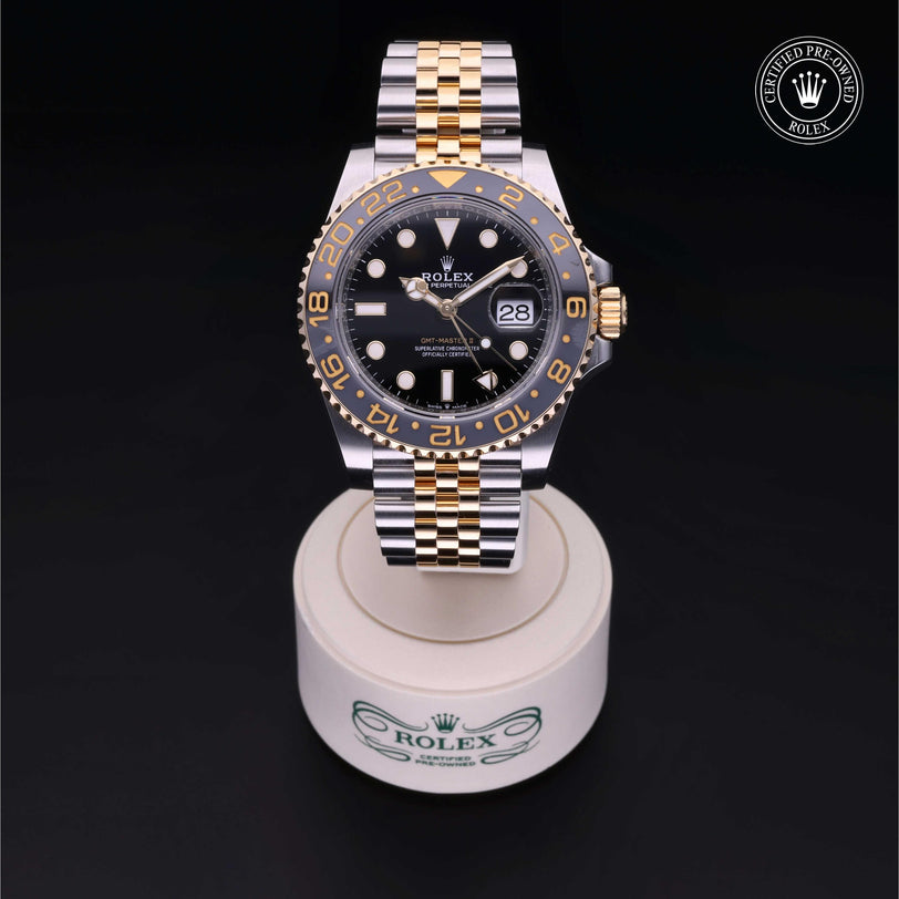 Rolex Certified Pre-owned GMT II M126713GRNR-0001 front on black background