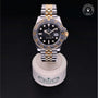 Rolex Certified Pre-owned GMT II M126713GRNR-0001 front on black background