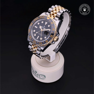Rolex Certified Pre-owned GMT II M126713GRNR-0001 front on black background