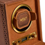 Brown leather watch winder with brass trim, circular watch holder, and control panel with dial and digital display.