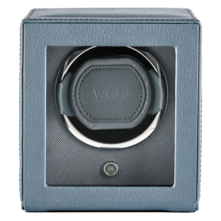 Gray leather watch winder with single circular cushioned watch holder and power button.
