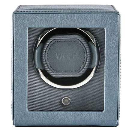 Gray leather watch winder with single circular cushioned watch holder and power button.