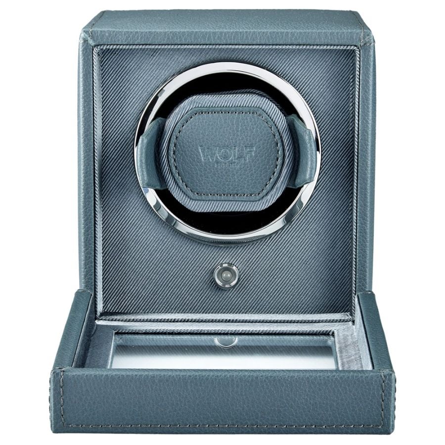 Blue-gray leather watch winder with single rotating cup, chrome accents, and hinged cover.