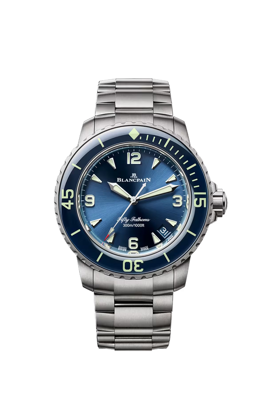 Blancpain Fifty Fathoms watch with sunburst blue dial, luminous hour markers, dark blue bezel, and satin-brushed titanium bra