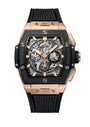 The Hublot Spirit Of Big Bang King Gold Ceramic is a luxury skeleton dial watch featuring a black rubber strap and a rose gold and black rectangular case.