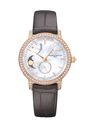 Rose gold watch with white mother-of-pearl dial, moon phase display, power reserve indicator, diamond bezel, and black leathe