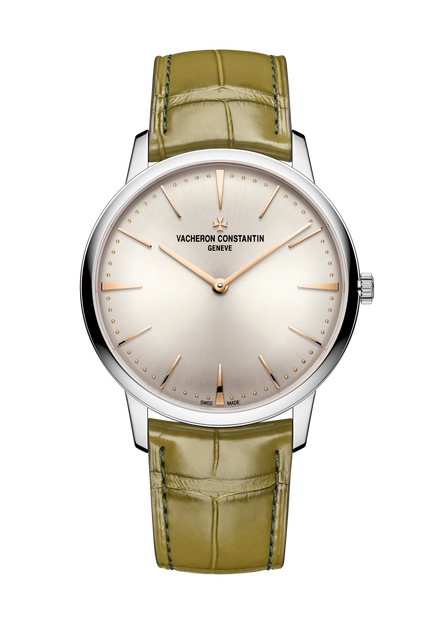 Silver-tone watch with cream dial, rose gold hands and hour markers, green crocodile leather strap.