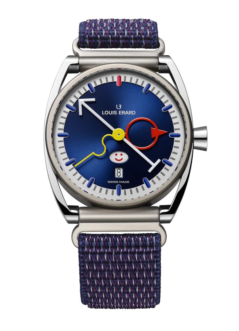 Steel watch with blue dial, colorful hands, smiley face, and dark blue textile strap.