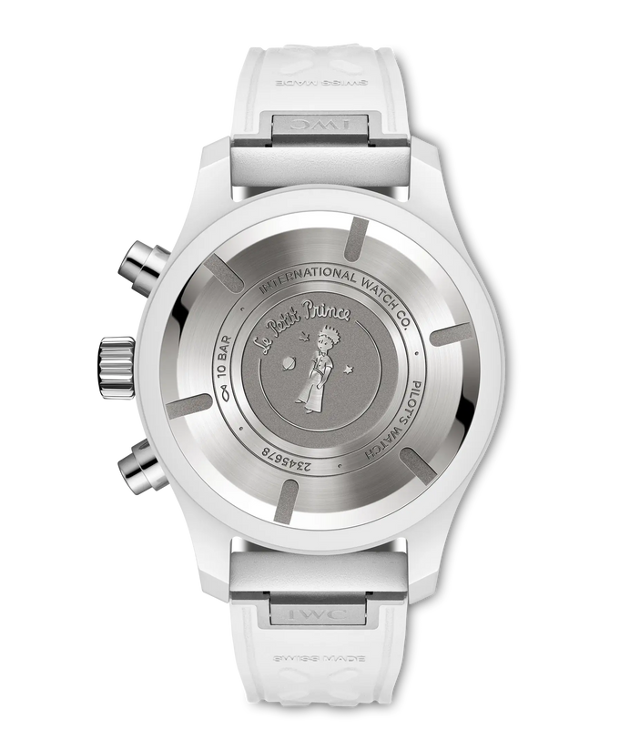 Silver chronograph watch with white rubber strap and Le Petit Prince engraving on caseback.