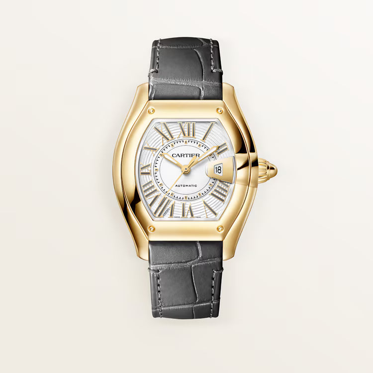 Gold-tone watch with tonneau-shaped case, white dial, Roman numerals, date window, and black leather strap.