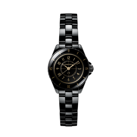 Black Chanel watch with a white background