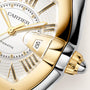 Cartier Roadster watch with two-tone gold and silver case, white dial, gold hands, and date window displaying 18.