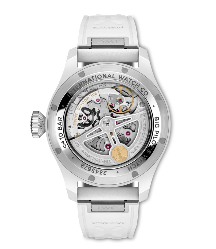 Stainless steel pilot watch with visible mechanical movement, white rubber strap, and exposed skeleton dial with golden rotor