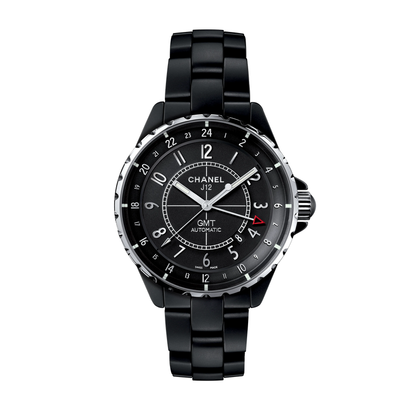 A Chanel J12 GMT black watch with high-precision automatic movement, black ceramic bracelet, silver accents, 24-hour dial, and a red-tipped GMT hand shown on a white background.
