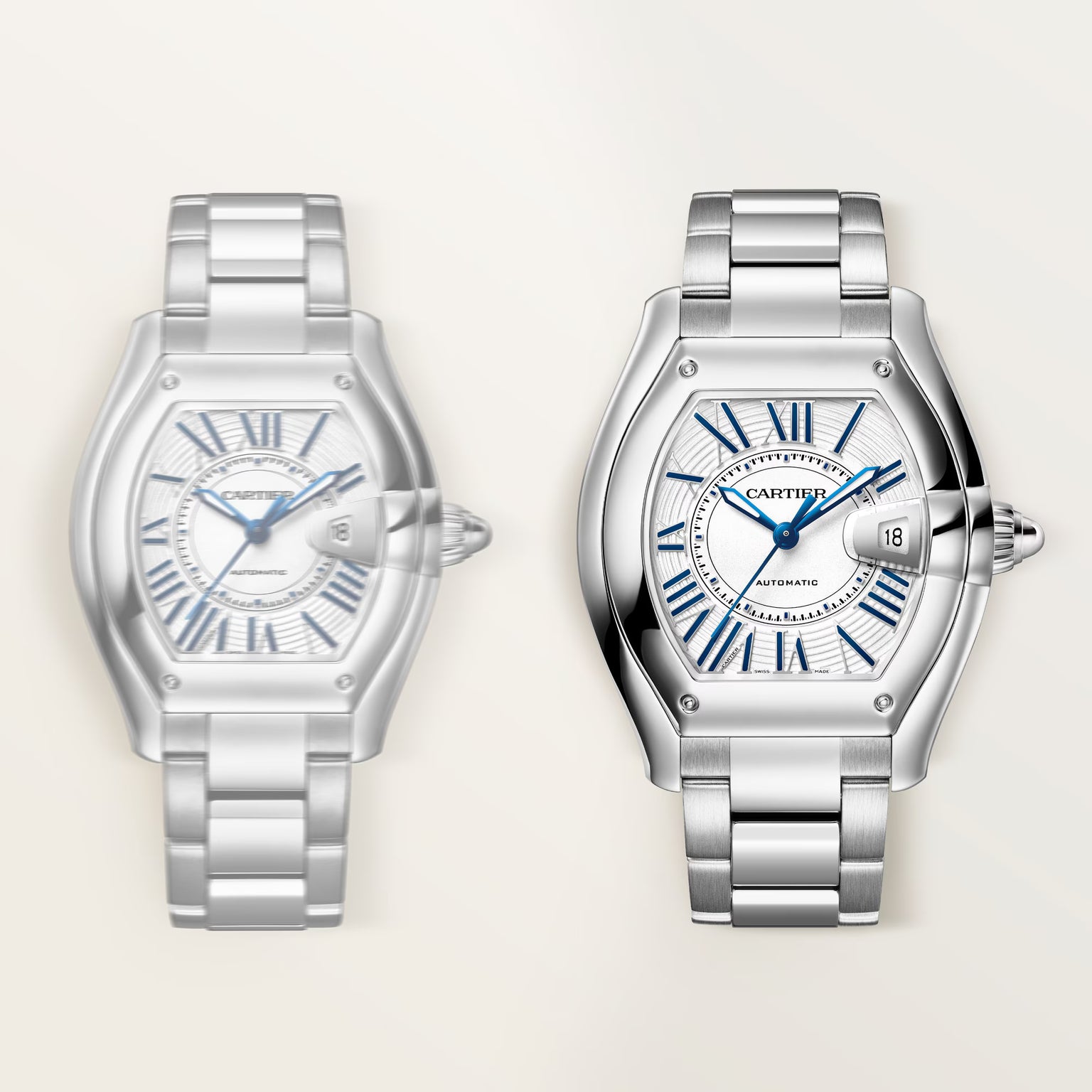 Two silver-tone stainless steel watches with barrel-shaped cases, blue Roman numeral dials, and matching metal bracelets disp