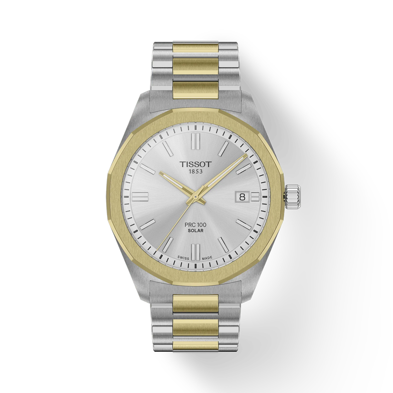 Tissot watch with silver and gold band on a white background